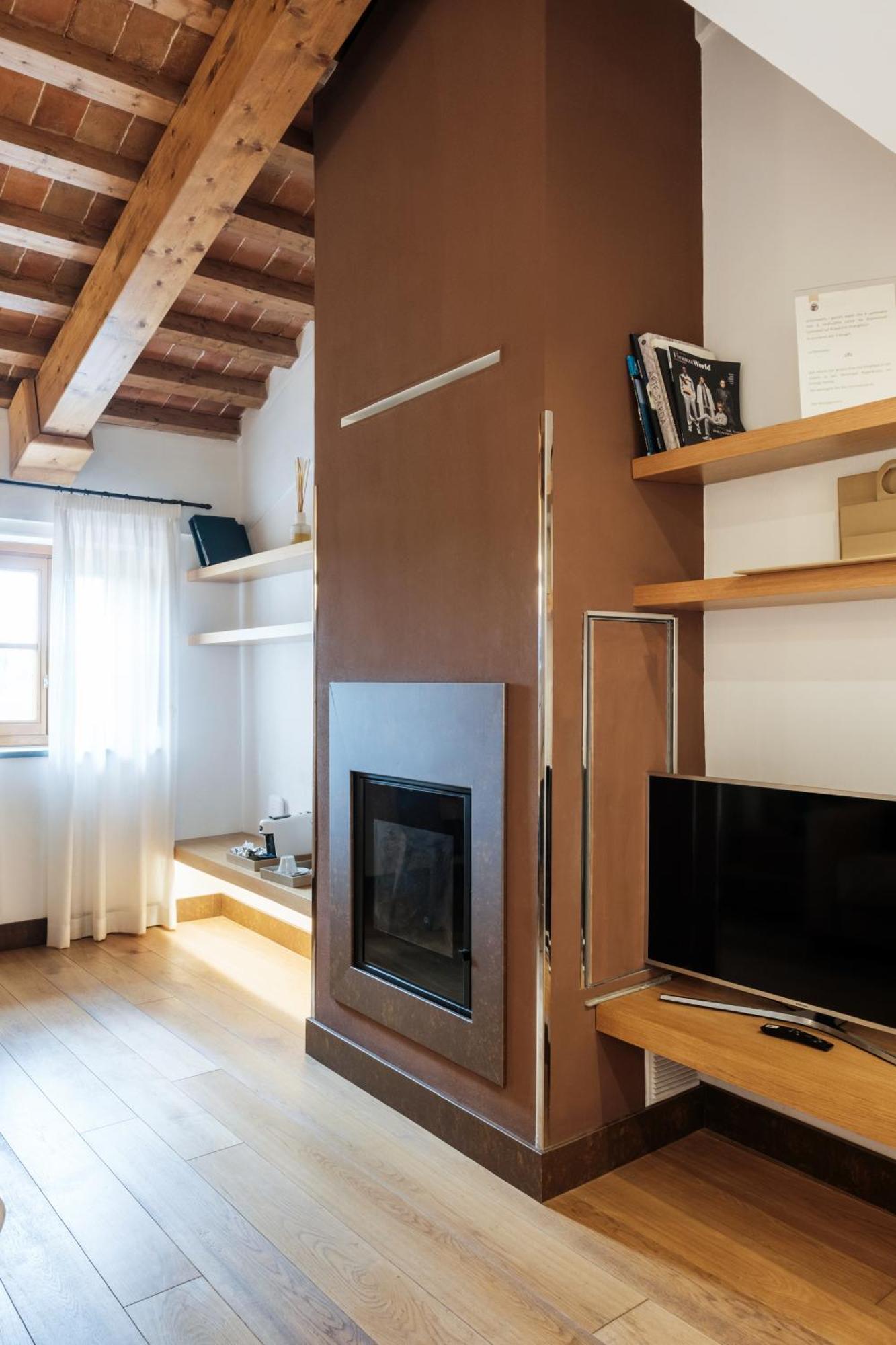 วิลล่า โตโลเม โฮเทล แอนด์ รีสอร์ต ฟลอเรนซ์ ภายนอก รูปภาพ A fireplace in a hotel room